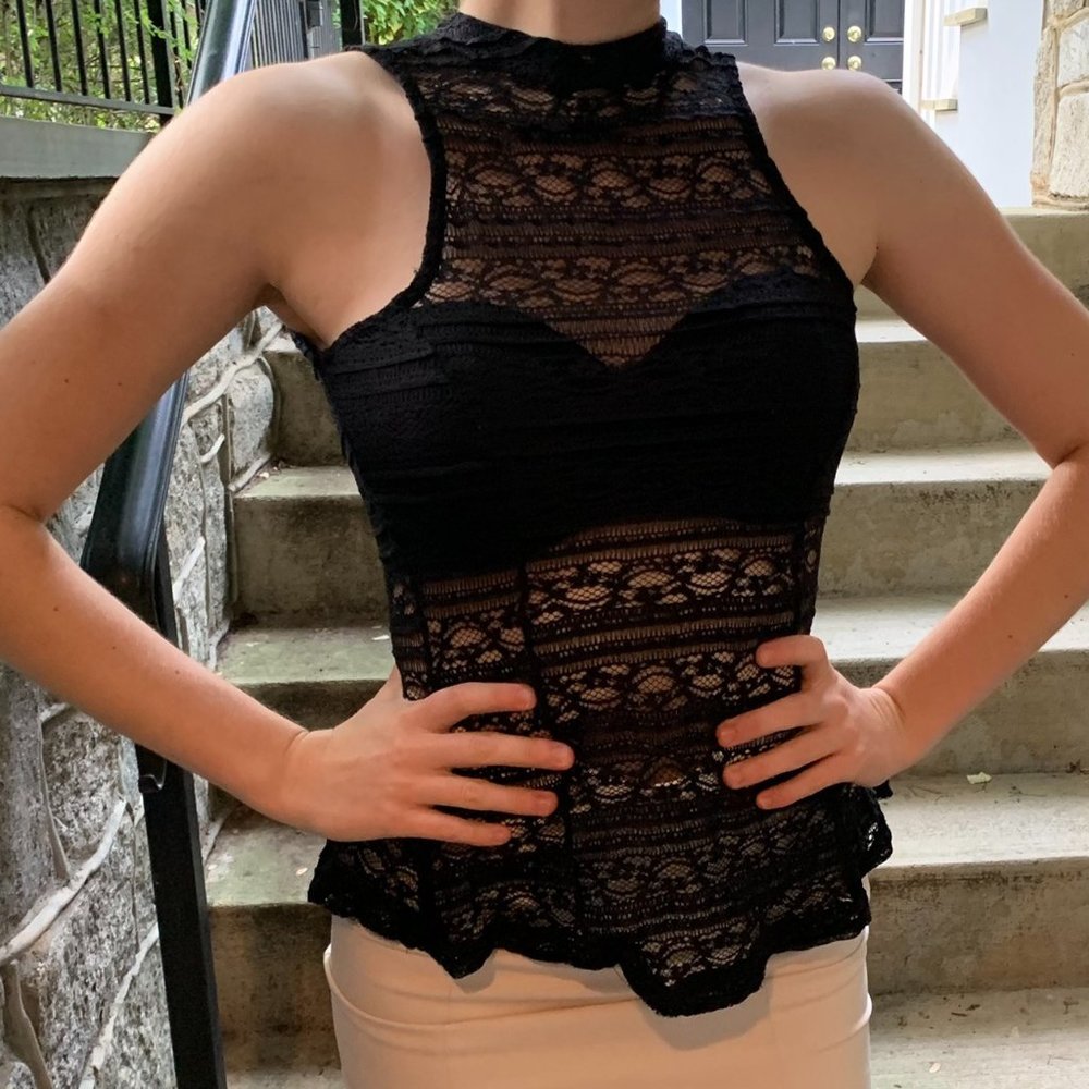 sheer mock neck top with a peplum shape